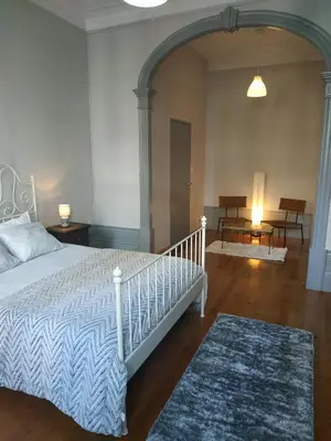 a bedroom with a white bed in a room at Gabriel Guesthouse in Porto