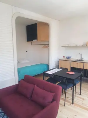 a living room with a couch and a table at Step In Porto Apartments in Porto