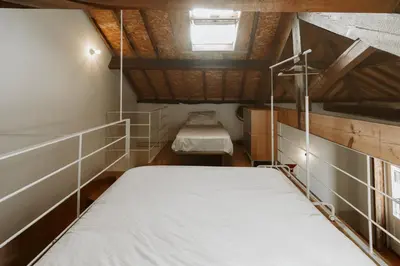 a bedroom with two beds in a small room at Step In Porto Apartments in Porto