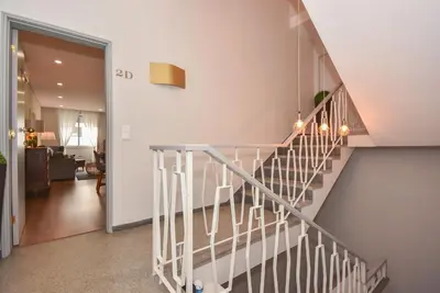 a staircase in a house with a living room at Rosario's Boutique Apartments in Porto