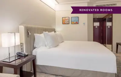 a hotel room with a bed and a couch at Crowne Plaza Porto by IHG in Porto