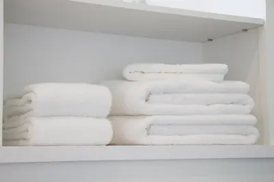a bunch of towels are stacked in a closet at Casa d'Avó in Porto
