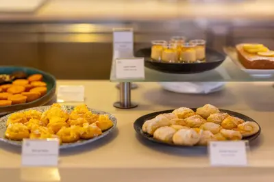 a buffet of pastries and other foods on a counter at Sheraton Porto Hotel & Spa in Porto