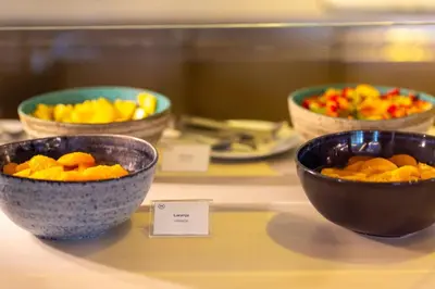 three bowls of fruit sitting on a table at Sheraton Porto Hotel & Spa in Porto