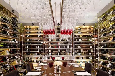 a dining room with a table with wine glasses at Sheraton Porto Hotel & Spa in Porto