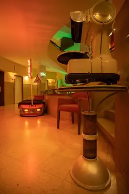 a room with a table with a machine on it at Pao de Acucar Hotel in Porto