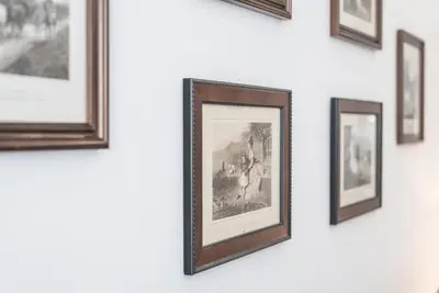 a picture frame hanging on a wall with pictures at GuestReady - Feels like Heaven in Porto