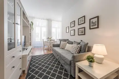 a living room with a couch and a table at GuestReady - Feels like Heaven in Porto