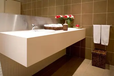 a bathroom with a sink and a mirror at TRYP by Wyndham Porto Centro Hotel in Porto