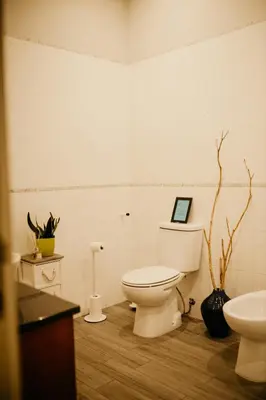 a bathroom with a toilet and a sink at H.ö.H in Porto