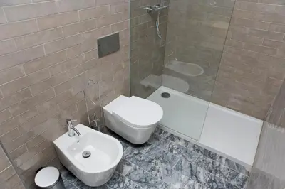 a bathroom with a sink and a toilet and a shower at Oporto Cool - Fontainhas in Porto