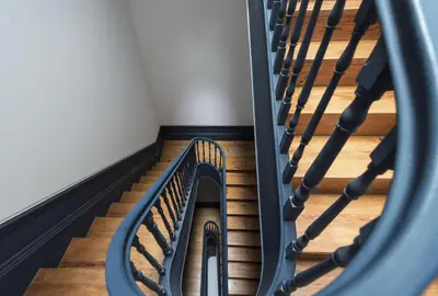 a spiral staircase in a building with wooden floors at Tripas-Coração, São Bento Apartments in Porto