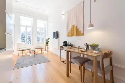 a bathroom with a glass shower with a toilet at Tripas-Coração, São Bento Apartments in Porto