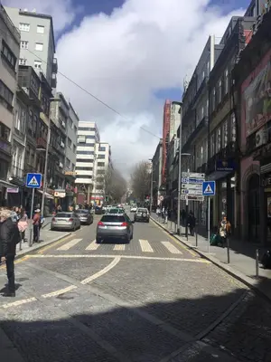 a city street with cars driving down the street at S Bento Boutique Apartment in Porto