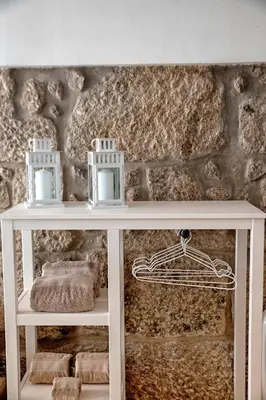 a white console table with two candles on top at Try Oporto - Ribeira in Porto
