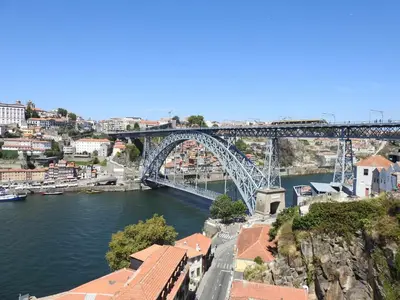 a bridge over a river with a city at Oporto Delight 2 Luxury Apartment in Historic Center Max 4p in Porto