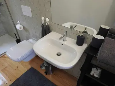a bathroom with a sink and a toilet at Oporto Delight 2 Luxury Apartment in Historic Center Max 4p in Porto