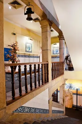 a staircase in a house with a stair case at Hotel Internacional Porto in Porto