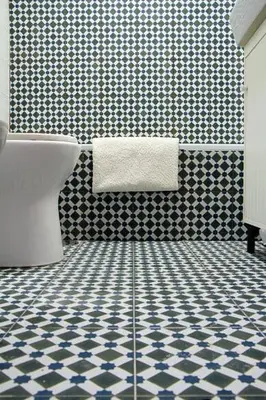 a bathroom with a toilet and a tiled floor at Historical Porto/Gaia Apartment in Porto