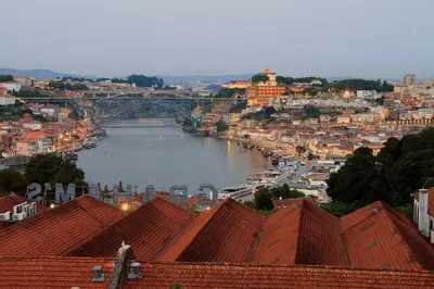 a view of a river in a city with a bridge at Historical Porto/Gaia Apartment in Porto