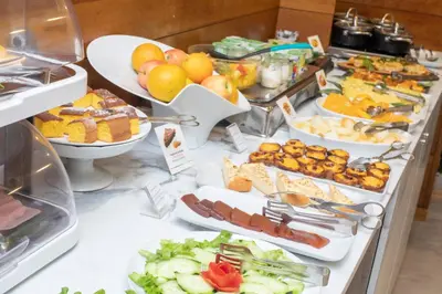 a buffet with many different types of food on a table at Casual Inca Porto in Porto