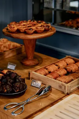 a display of pastries and other pastries on a table at Hotel da Bolsa in Porto