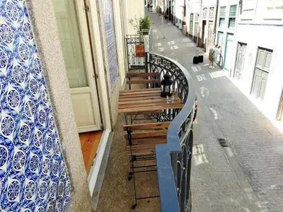 a row of benches on the side of a building at Oporto Delight 1 Luxury Apartment in Historic Center with Balcony Max 4 p in Porto