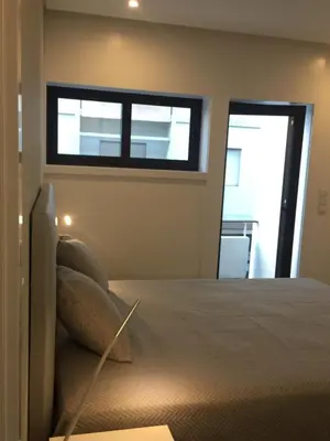 a bedroom with a bed and a window at SantOporto Baixa in Porto