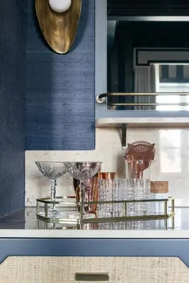a kitchen with a counter with glasses on it at Infante Sagres - Small Luxury Hotels Of The World in Porto