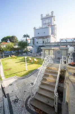 a stairway leading up to a building with a building at Castelo Santa Catarina in Porto