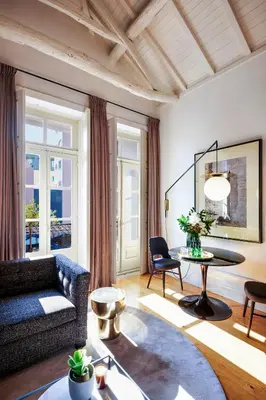 a living room with a couch and a table at The A5 Smart Luxury Studios in Porto