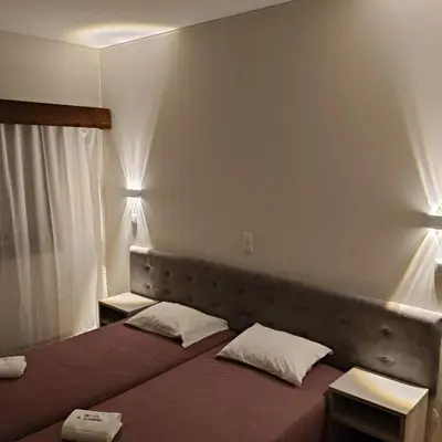 a bedroom with a bed with two pillows on it at Hotel S. Gabriel in Porto