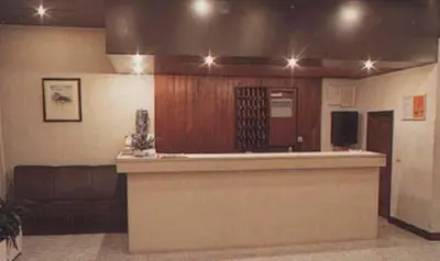 a large kitchen with a bar in a building at Hotel Palanca in Porto