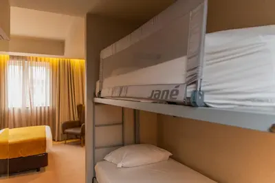 a room with two bunk beds and a bed at WOT Porto Soul in Porto