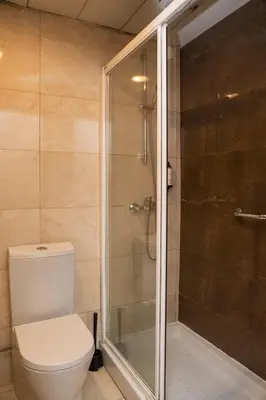 a bathroom with a toilet and a shower at WOT Porto Soul in Porto