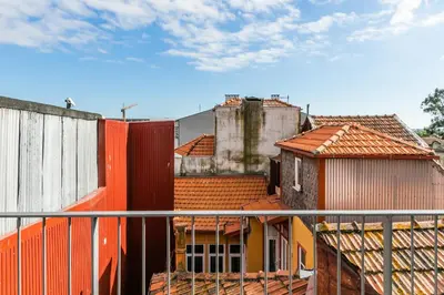 a group of buildings with red roofs at Indulge Porto Flats in Porto