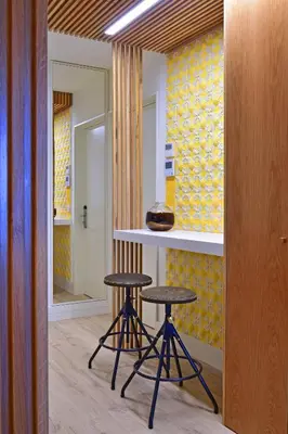 a kitchen with two stools and a counter in a room at My Story Apartments Porto - Santa Catarina in Porto