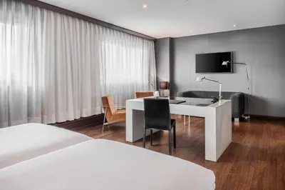a hotel room with a desk and a bed at AC Hotel Porto by Marriott in Porto