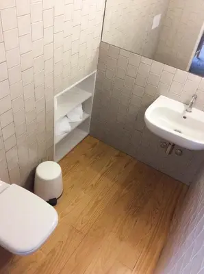 a bathroom with a toilet and a sink at Villa Lóios by Casa do Conto in Porto