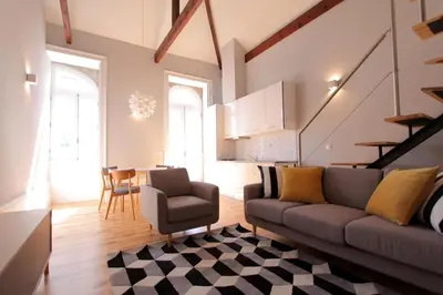 a living room with a couch and a table at Duque de Loulé in Porto