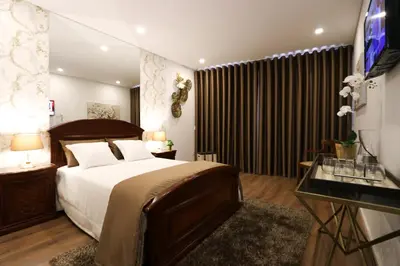 a bedroom with a large bed and a television at Bruval Premium Apartments - Sé Porto in Porto