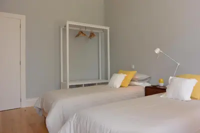 two white beds in a room with a window at Casa Paillard, by Flat in Porto in Porto