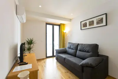 a living room with a couch and a table at OTF- Porto Centro in Porto