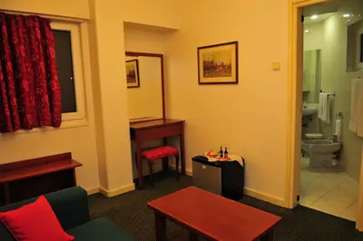 a room with a bathroom with a sink and a toilet at Vera Cruz Porto Downtown Hotel in Porto