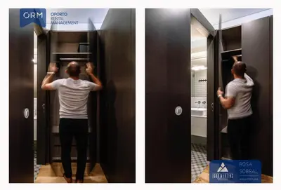 a man is standing in front of a mirror at ORM - Camões Apartment in Porto