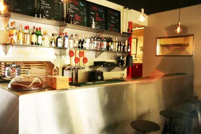 a bar in a restaurant with a lot of drinks at PILOT Design Hostel & Bar in Porto