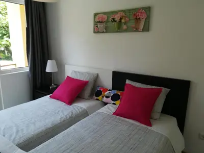 two beds sitting next to each other in a bedroom at Kris Apartments Porto in Porto