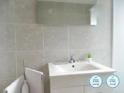 a bathroom with a white sink and a mirror at RS Porto Vilar in Porto