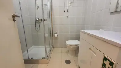 a bathroom with a shower and a toilet and a sink at Downtown Porto with PARKING next to subway in Porto