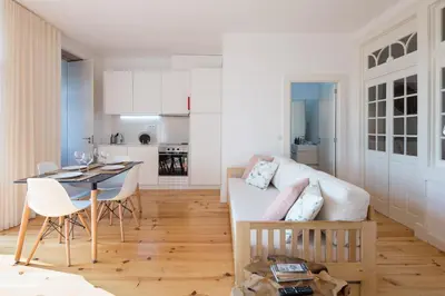 a living room with a couch and a table at LovelyStay - Martires Boutique Flat in Porto
